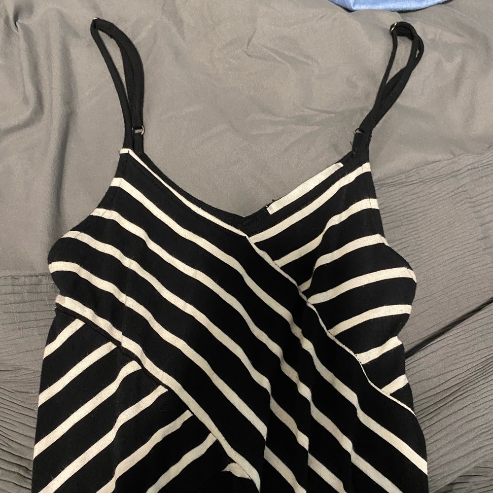 Long dress. Slight tight, sexy fit. Crossed top with spaghetti strap